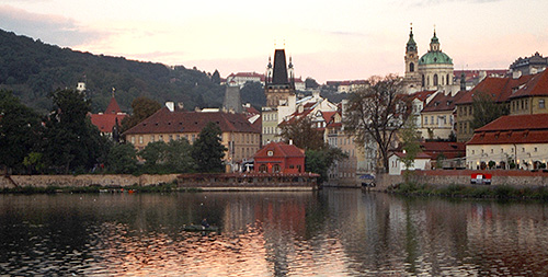 The Vlatava river in Prague.  Note the early morning fisherman. (2003)