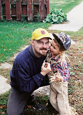 Uncle Peter with his nephew Alex.  We were all visiting my dad in Illinois.  Alex was dressed as a scarecrow for a Halloween party at the Moose Lodge. (2002)