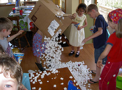 Dress rehearsal for anarchy masquerading as my nephew Alex's 6th birthday celebration.  Alex is holding the box.  (2005)