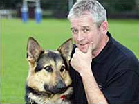 Buster, the fired police dog (left).  (2005)
