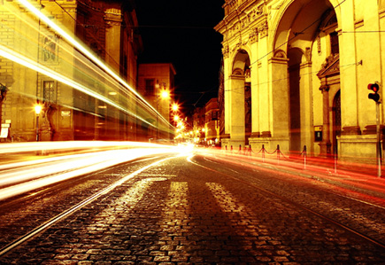 Prague In Motion.  Yes, those streaks are from car headlights (and one train!) as vehicles whizzed past me while I stood in the center of the street.  (2003)