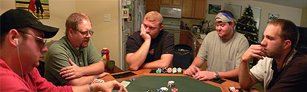 Poker at Jimmy's house.  From left to right, you have Lou, Richard, Jimmy (Lou's brother), Rob and Mike.  This picture was taken early in the night when we were in the middle of our first tournament, No Limit Omaha Hi/Lo. (2005)