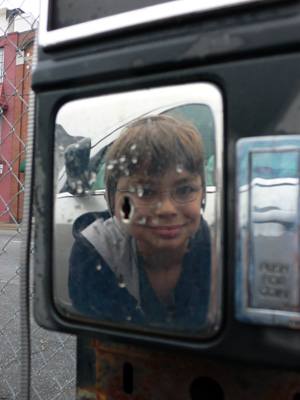 One more pay phone reflection shot of Nephew Alex in parking lot near the Georgia Aquarium.