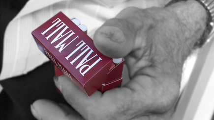 Close-up of Mamacita's Jim holding a pack of his cigarettes.  (2007)