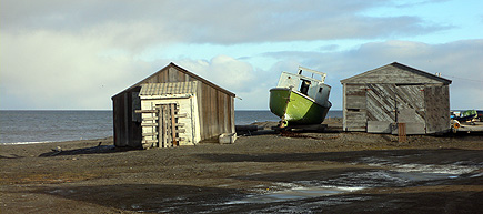 Boat between houses in Barrow, east of the whalebone arch.  (2007)