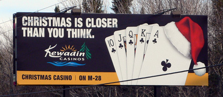 Billboard for the casino in Christmas, Michigan.  Don't mind the telephone wires please.  (2007)