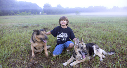 Alex and Argus and Sheriff watching the sun come up at The Lake Bottom.  (2008)