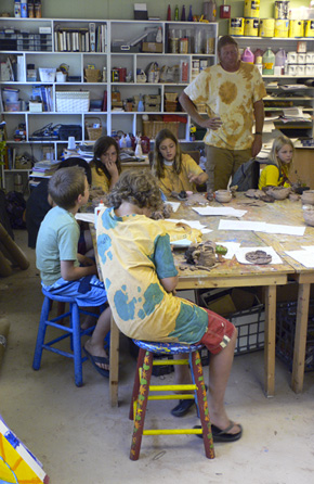 Alex working with his class at pottery camp.  (2008)