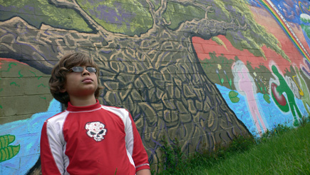 Nephew Alex in front of another Gaines Street mural.  (2008)