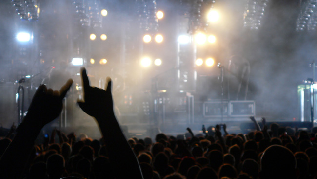 Unbeknownst to me at the time, an anonymous fan throws the devil horns hand gesture while I'm taking a picture at the Nine Inch Nails show in Tampa on May 9th, 2009.  (2009) 