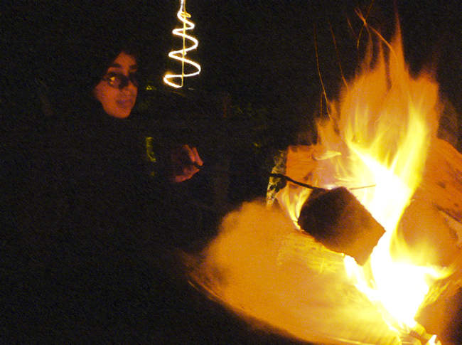 Alex playing with the Yule fire last year.  (2008)
